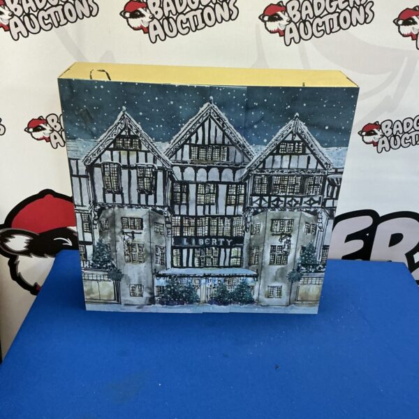 Front view of a vintage Liberty Advent calendar with a snowy scene.