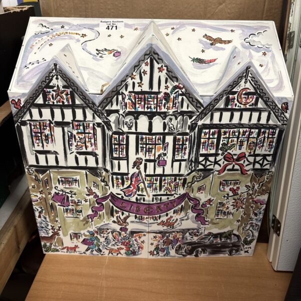 Front view of a vintage Liberty advent calendar with a festive village scene.