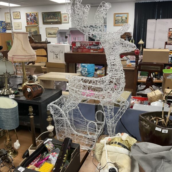 Illuminated acrylic reindeer Christmas decoration for festive displays.