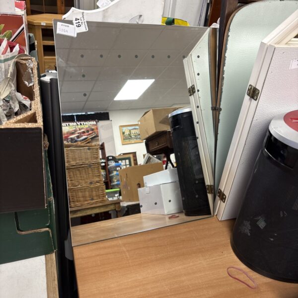 Modern light-up bathroom mirror with integrated lighting.