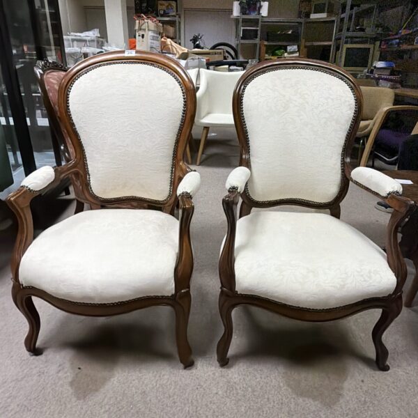 Elegant pair of 19th-century Louis Philippe fireside chairs in walnut.