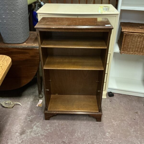 Antique mahogany bookcase with three adjustable shelves.