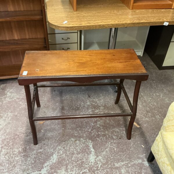 Antique Victorian mahogany occasional table with elegant legs.