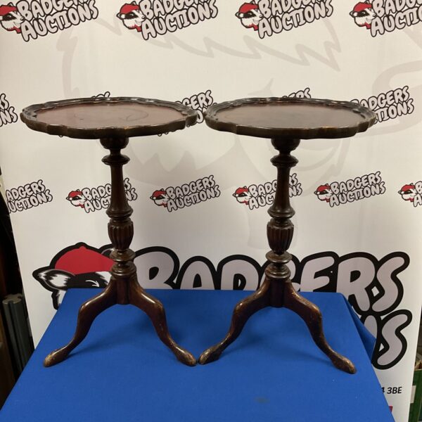 Antique mahogany lamp tables with pie crust edges.