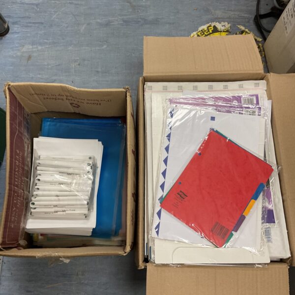 Lot of mailing and packaging supplies including plastic bags and pens.