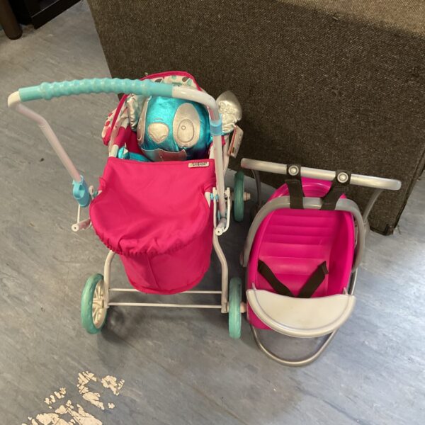 Pink Mamas Papas dolls pram with baby rocker chair.