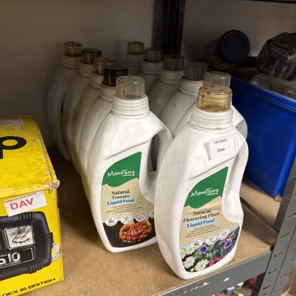 Eleven bottles of Mamaterra plant food for garden care.