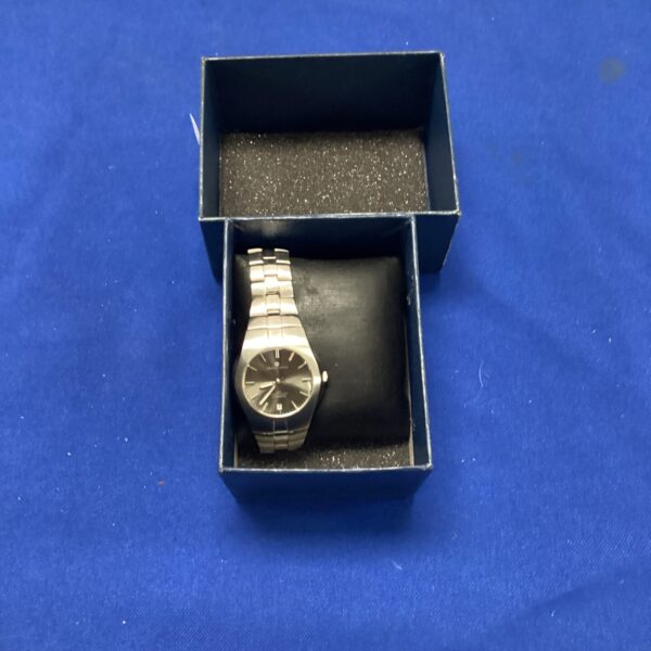 Silver Marco Ceroni wristwatch displayed in its presentation box.