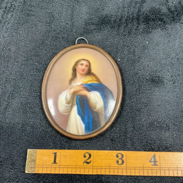 Antique 19th-century porcelain plaque depicting Mary Magdalene in blue and white.