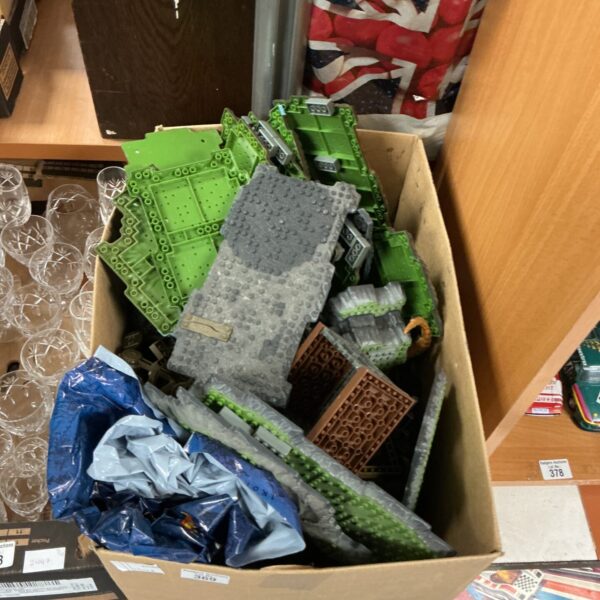 Green and grey Mega Blox building blocks in a toy lot.