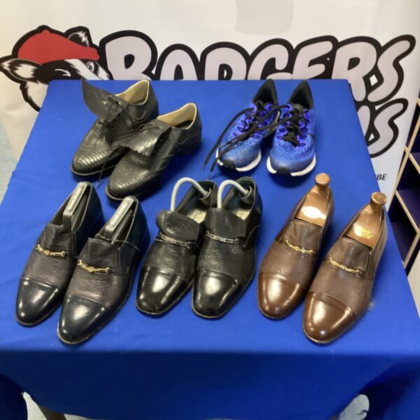 Lot of five pairs of men's designer shoes in various styles and colours.