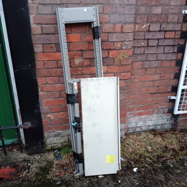 Metal racking unit for storage with adjustable shelves.