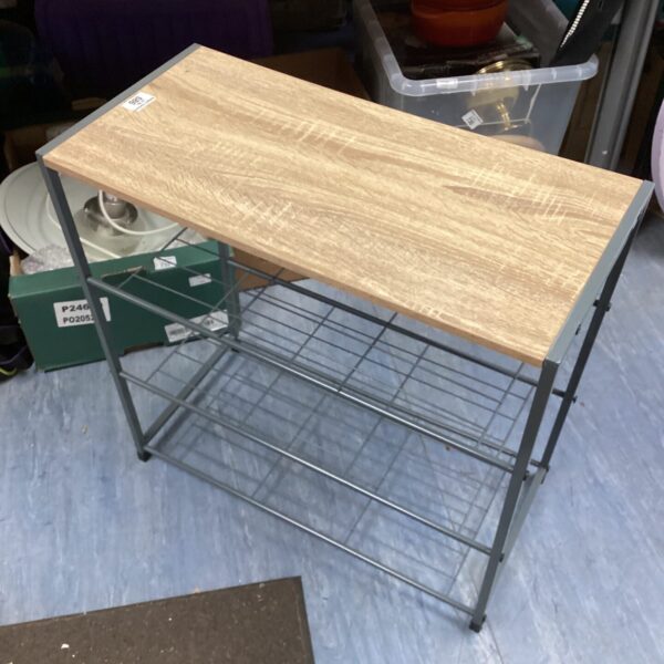 Metal shoe rack with wooden top shelves for organised storage.