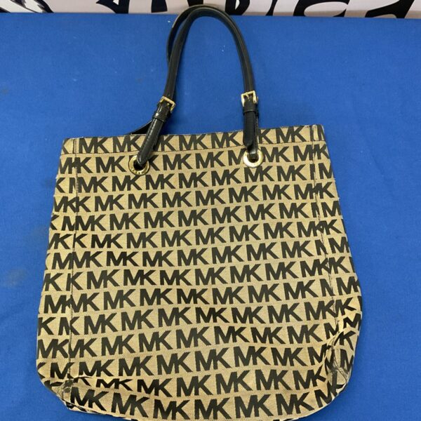 Front view of a pre-owned Michael Kors leather handbag.
