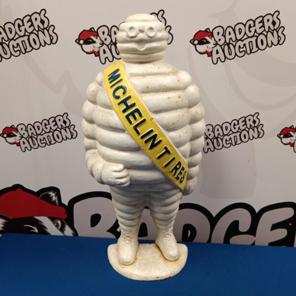 Vintage cast iron Michelin Man statue, iconic advertising collectible.