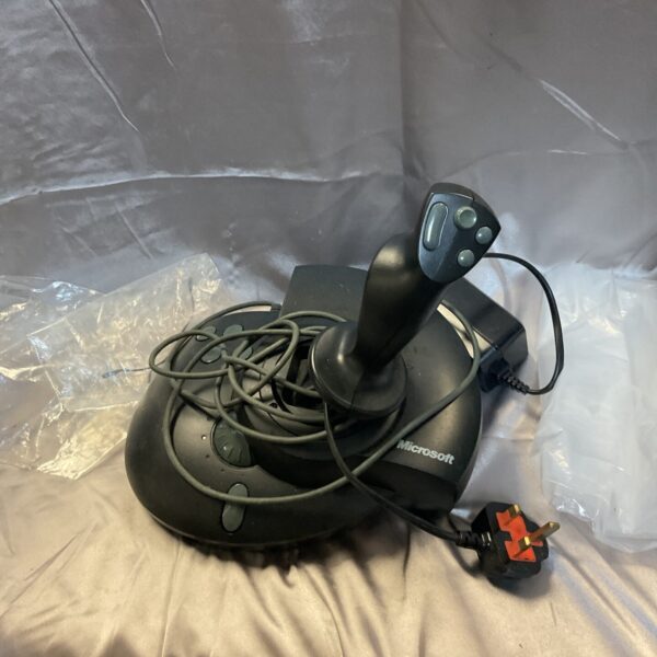 Vintage Microsoft Sidewinder force feedback joystick for PC gaming.