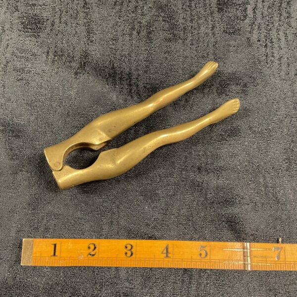 Vintage mid-century brass nutcracker with female figural design.
