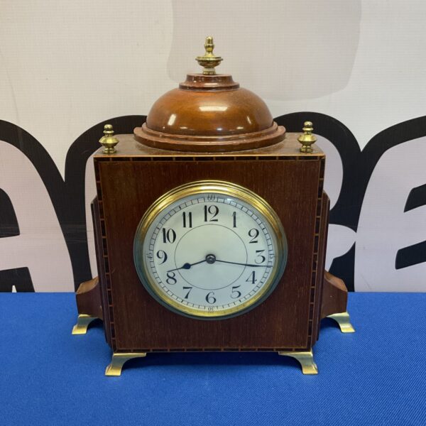 Vintage mid-century French mantle clock with wooden case.