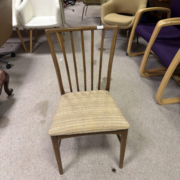 Vintage mid-century teak dining chair with sculpted back.