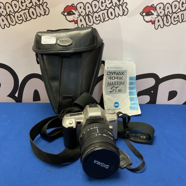 Vintage Minolta Dynax 404si 35mm film camera with strap.