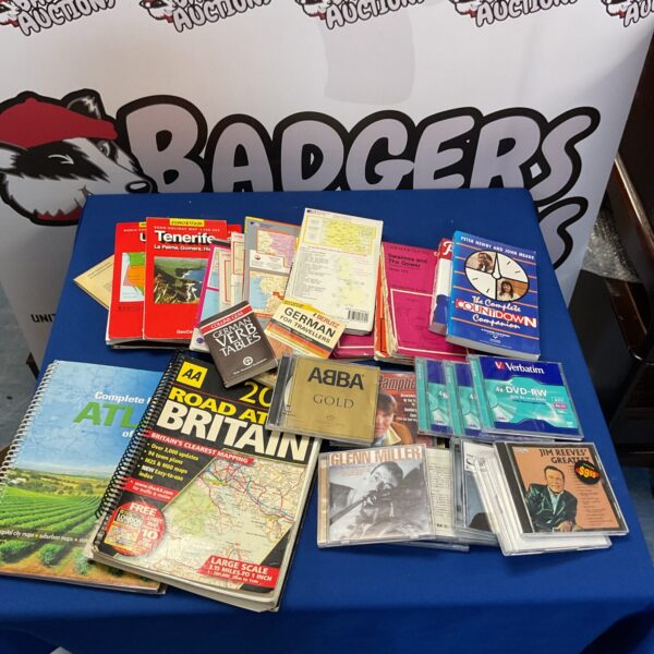 Mixed lot of books and CDs including travel guides and ABBA.