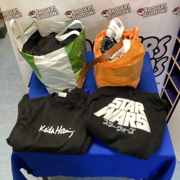 Mixed clothing lot featuring Star Wars and Keith Haring items.