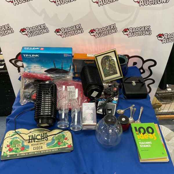 Mixed electronics lot including router, phone and headphones.