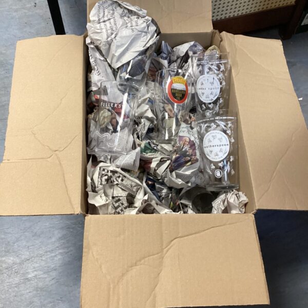 Mixed lot of branded glassware including Fullers and Wetherspoons glasses.