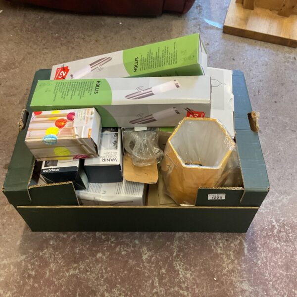 Mixed lighting lot including lamps, string lights and wall lights.