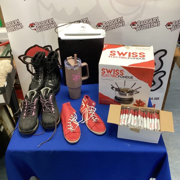 Mixed lot auction featuring boots, shredder, and fondue set.