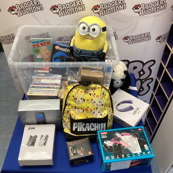 Mixed lot including DVDs, a Nokia phone, and an RC buggy.