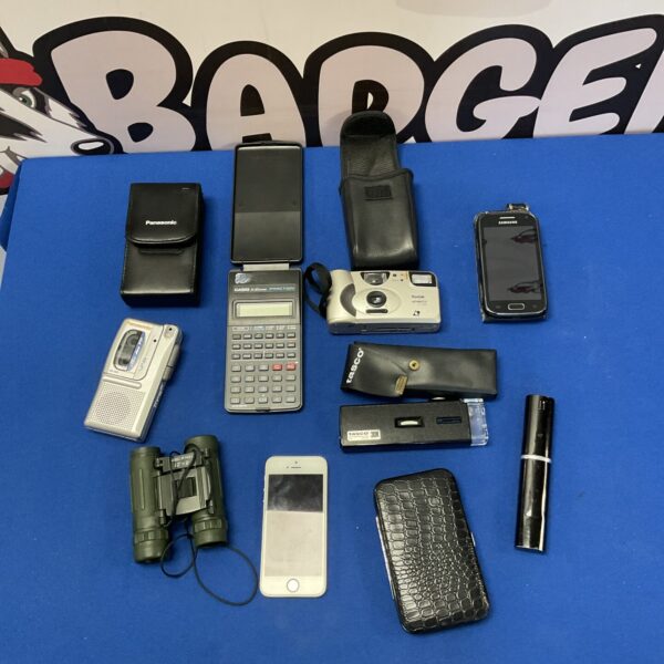 Mixed lot of vintage electronics including phones, cameras, and calculators.