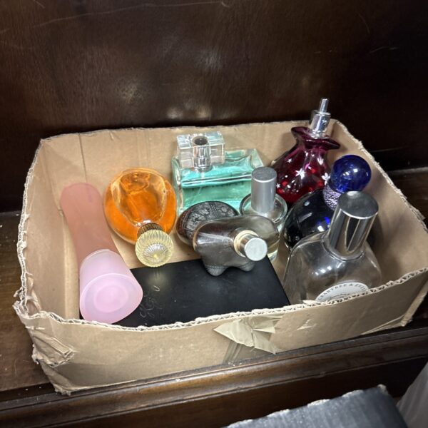 Mixed perfume lot with vintage and contemporary fragrance bottles.