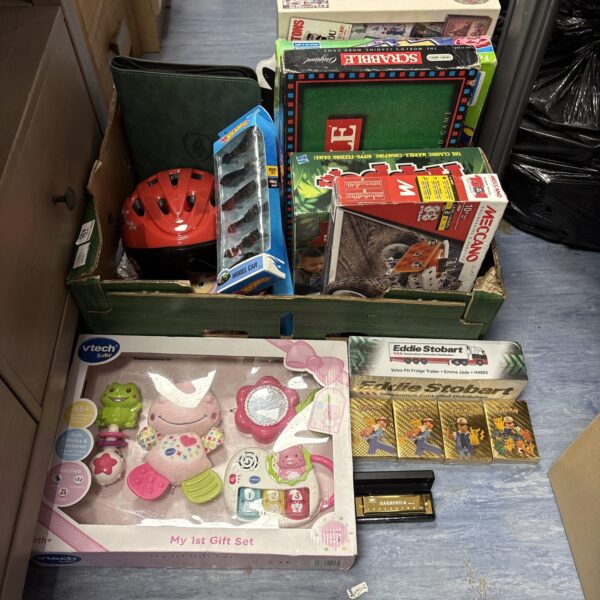 Mixed toy lot including Hot Wheels, Batman and VTech toys.