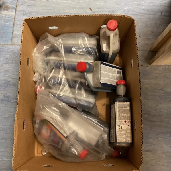 Several bottles of concentrated mortar plasticiser for construction use.