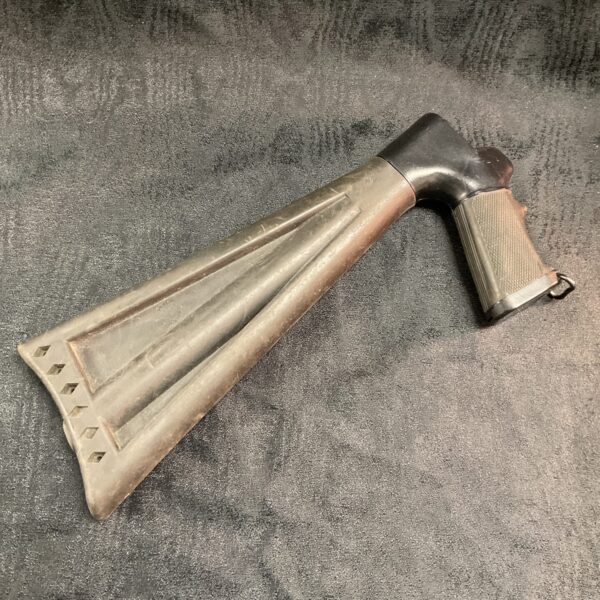 Vintage moss black rifle stock for a bolt-action rifle.