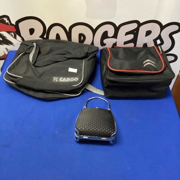 Motorcycle panniers, Citroen bag, and vintage clutch bag set.