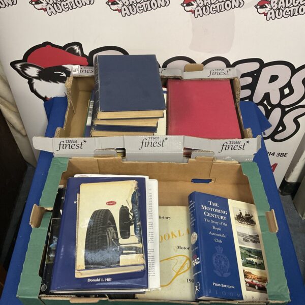 Vintage motoring books lot, classic car literature collection.