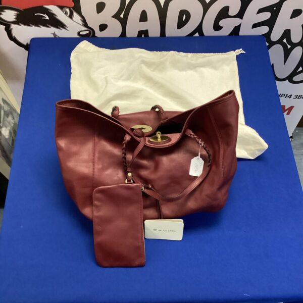 Burgundy Mulberry handbag with braided handles and matching purse.