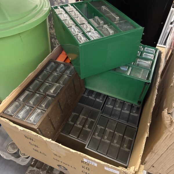 Lot of multi-drawer plastic organisers for small parts storage.
