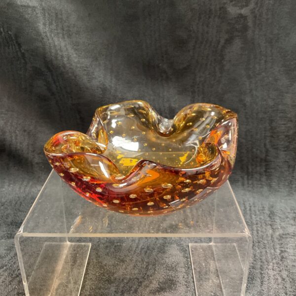 Vintage Murano glass bowl with a vibrant bubble texture.