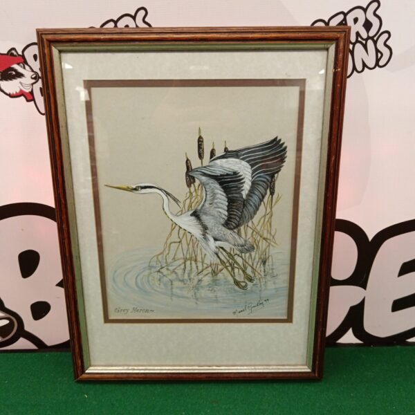 Muriel Gridley watercolour painting of a grey heron in a reed bed.