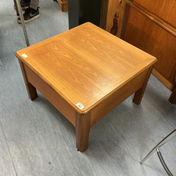 Vintage Nathan telescopic coffee table in warm wood tone.