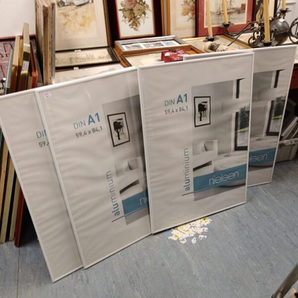 Set of four Nielsen aluminium DIN A1 picture frames for art display.