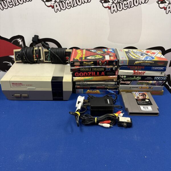 Vintage Nintendo NES console with game cartridges for retro gaming.