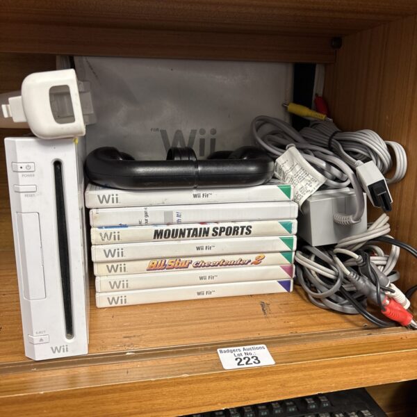 Nintendo Wii console with games and accessories for retro gaming.