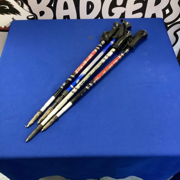 Lot of four Nordic walking sticks for fitness and outdoor activities.