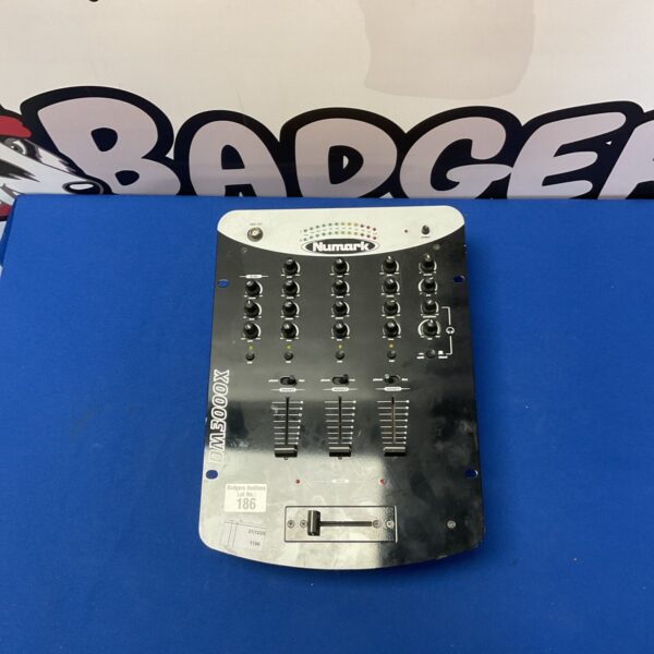 Vintage Numark DM3000X DJ mixer with channel controls.