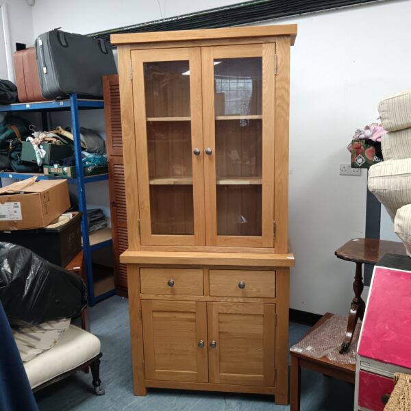 Vintage oak display cabinet with glazed doors.