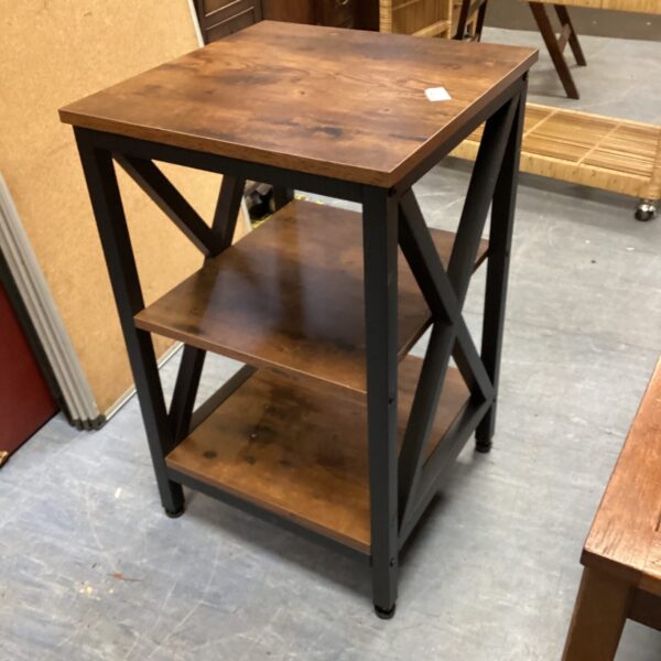Dark finished oak three tier side table for display.